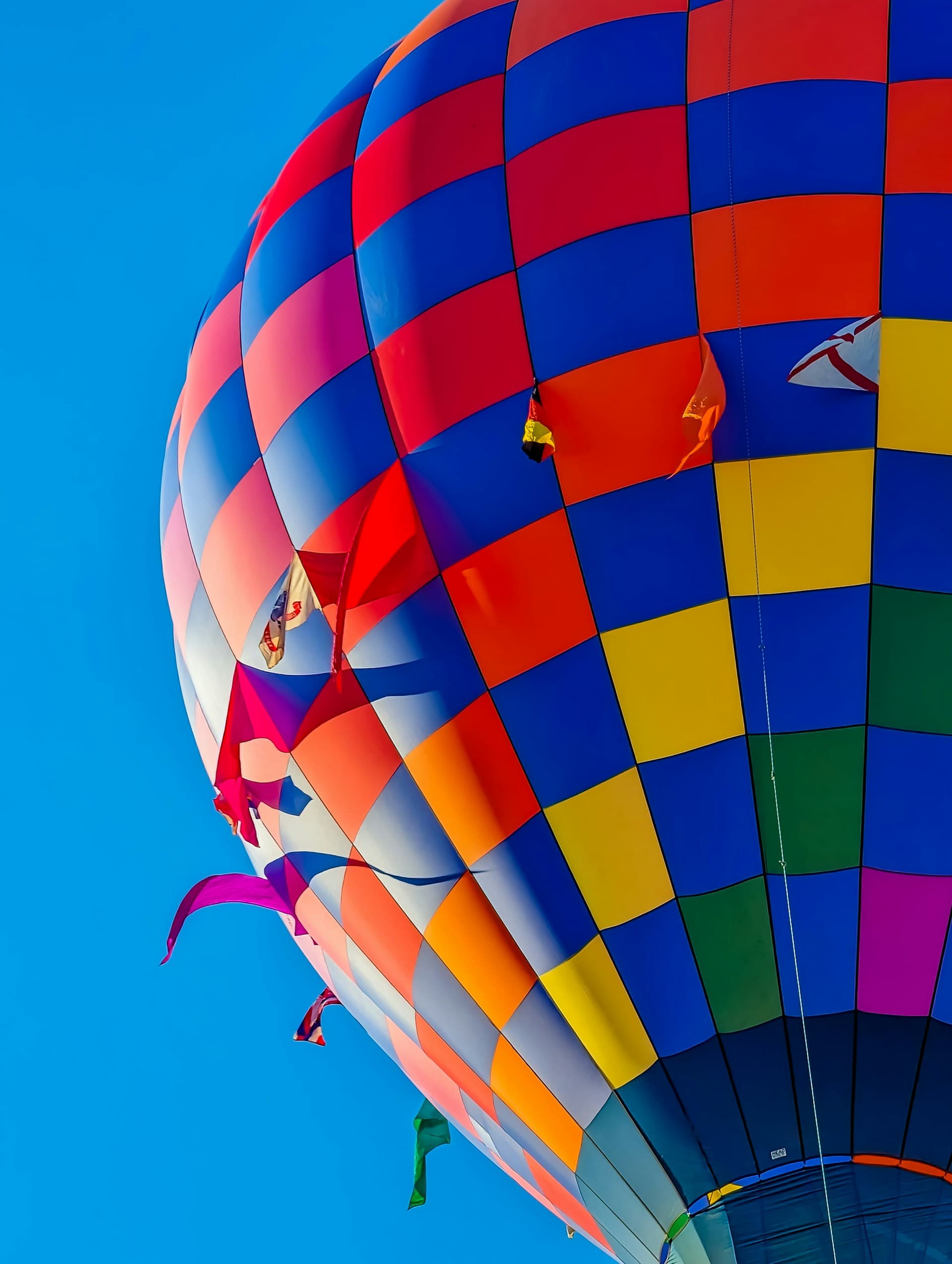 A hot air balloon in flight against a clear sky